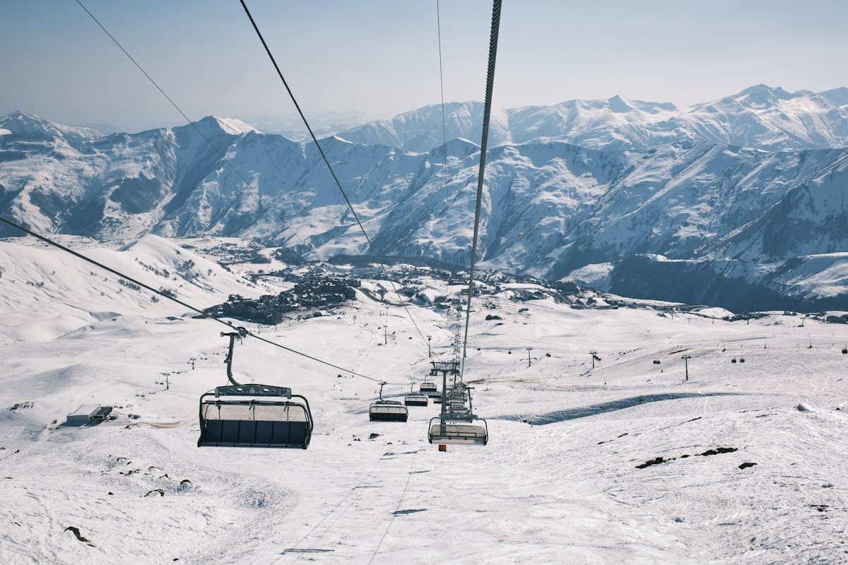 Chair lifts and snowy slopes at Gudauri