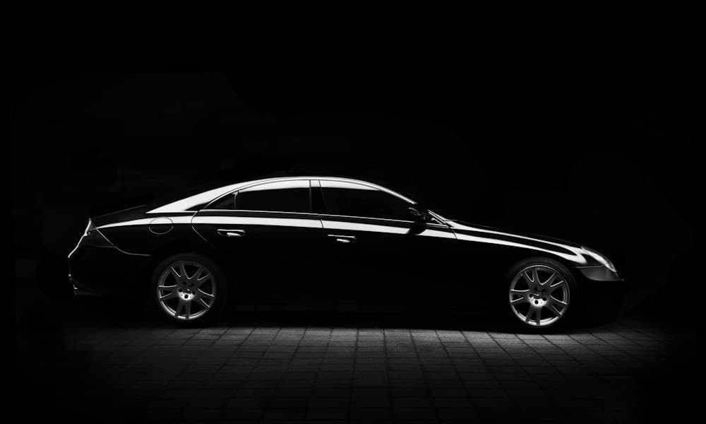 Side profile of a black executive sedan